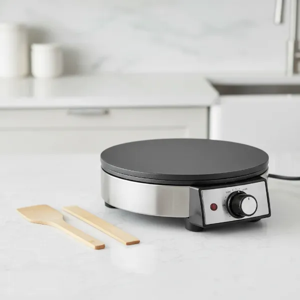 A sleek Chefman electric crepe maker and griddle with a 12-inch non-stick surface.
