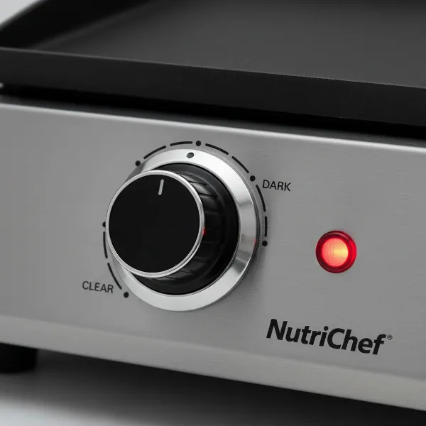 Close-up of a NutriChef Electric Griddle's adjustable rotary temperature dial and LED indicator light.