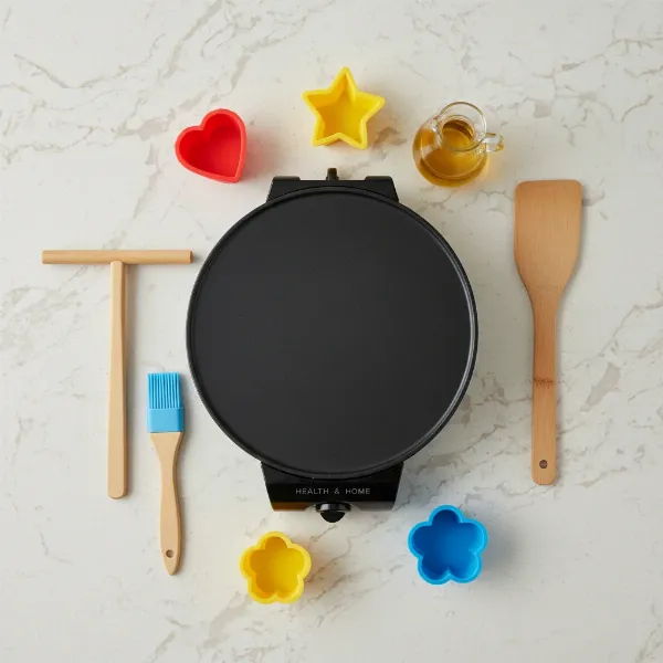 Health and Home 13-inch crepe maker displayed with its included wooden spreader, spatula, oil brush, and molds